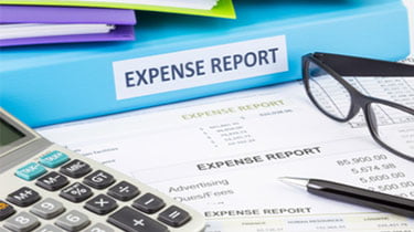 Controlling your business expenses, blue expenses report on desk
