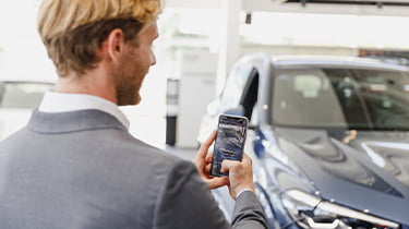 Claiming P11D - benefits in kind - employee looking at grey company car