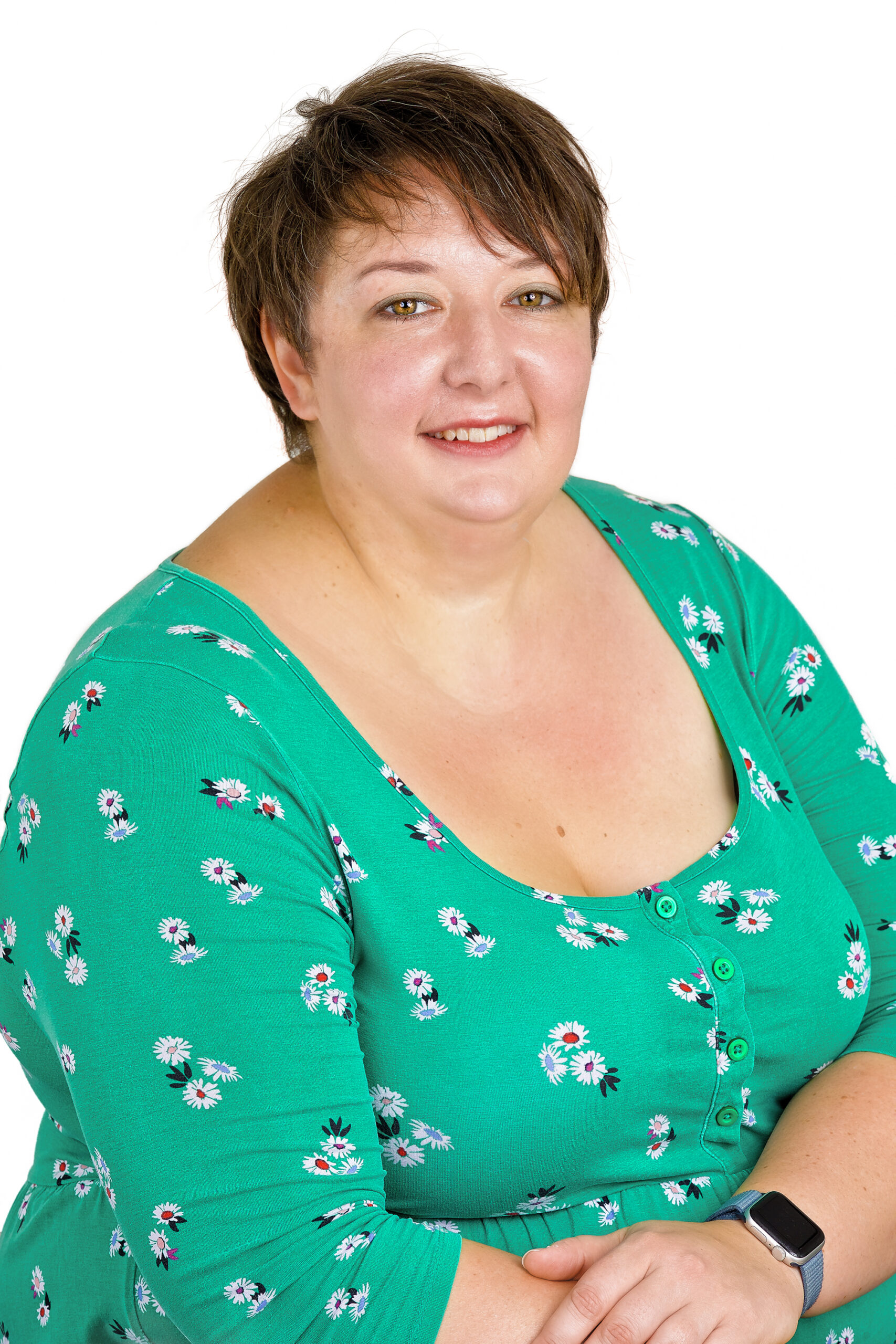 Stephanie Jackson in a green dress with white floral pattern on a white background